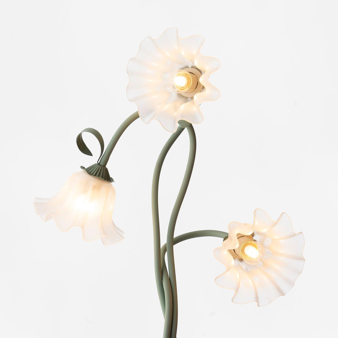 Tall green floral floor lamp featuring a crisp white shade for contemporary decor.