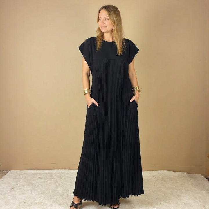 Lightweight women's pleated maxi dress, essential for comfortable, elegant summer style & versatile occasion wear.