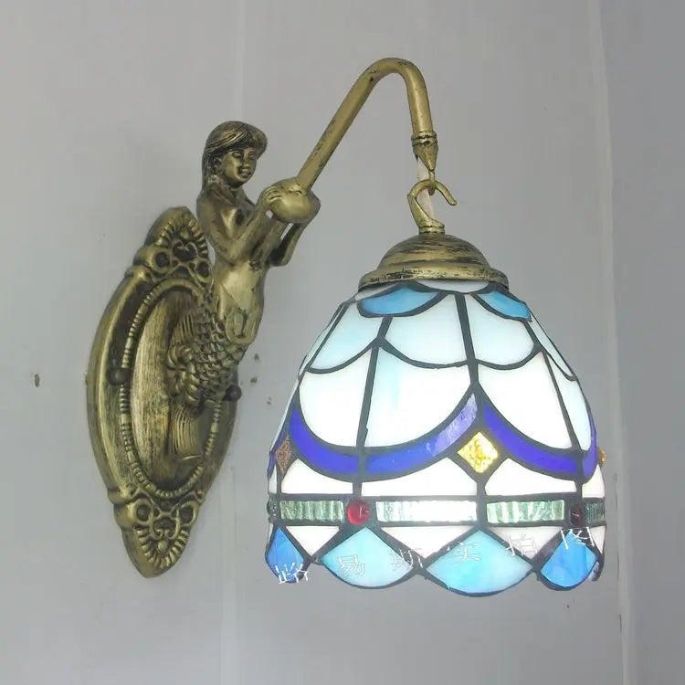LED wall light with intricate mermaid glass, providing artistic and decorative indoor lighting.
