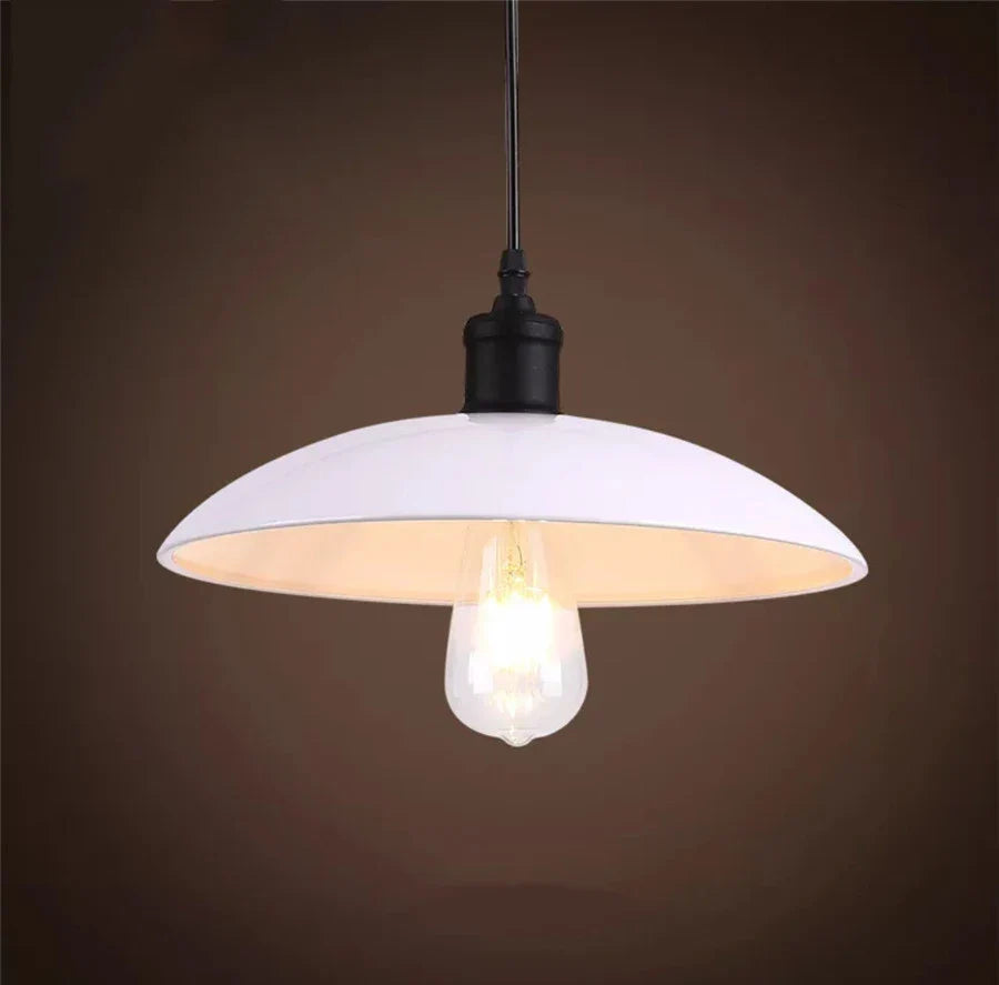 Rustic industrial pendant light, black iron construction, a focal point for any room.