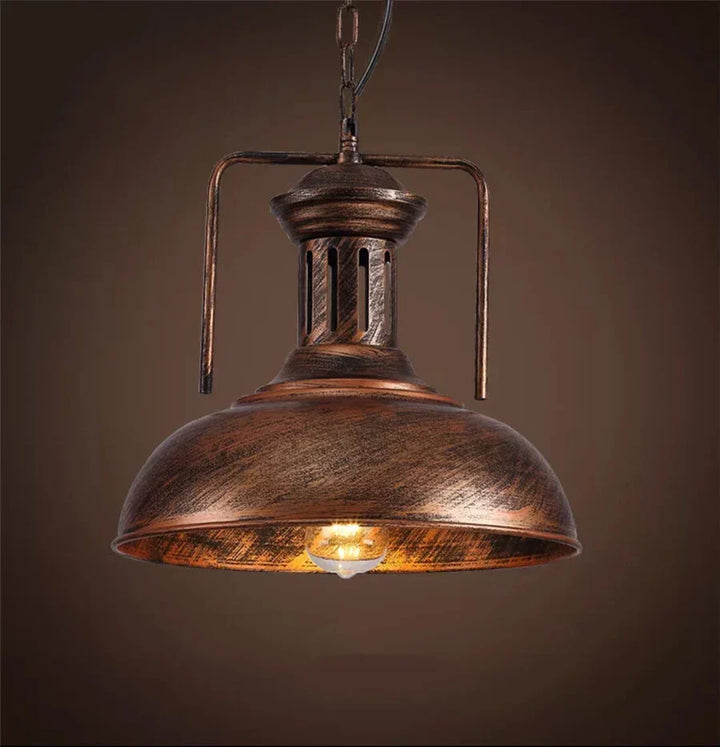 Rustic iron pendant light, farmhouse style, ideal for kitchen or dining room decor.