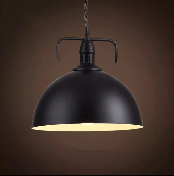 Farmhouse vintage pendant light, iron cage design, provides warm ambient light.