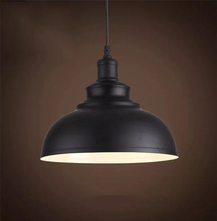 Dark iron pendant light, farmhouse rustic design, great for kitchen or dining room decor.