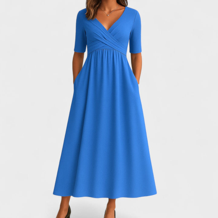 Pink V-neck midi dress for women, featuring a crossover waist for a flattering fit. Perfect for everyday style.
