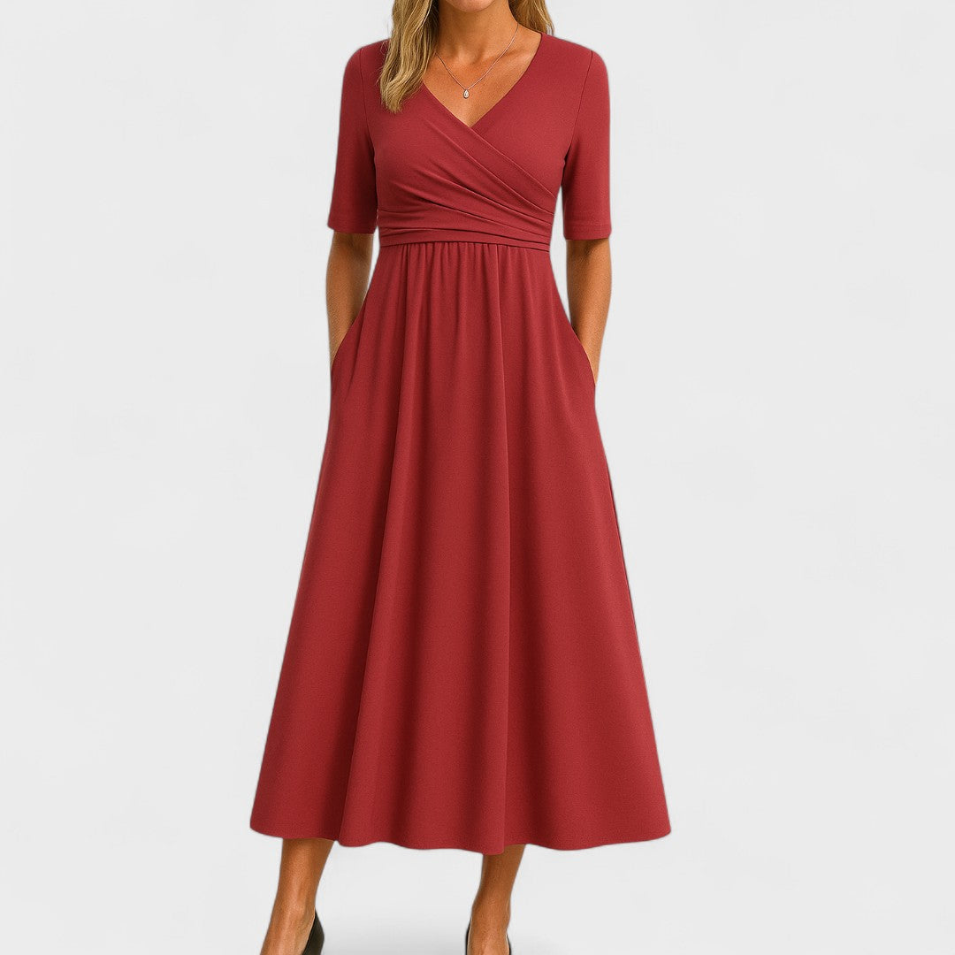 Gray V-neck midi dress with elegant crossover waist, enhancing the silhouette. A chic women's workwear staple.