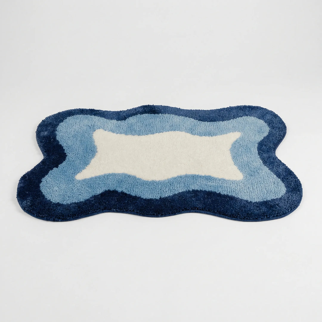 Plush Flowique wave bath rug. Soft, absorbent, and a modern statement piece for luxurious home decor.
