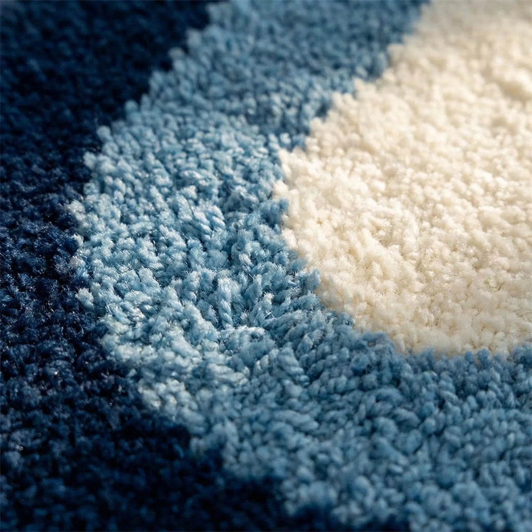Non-slip Flowique wave rug, perfect for bathroom safety or a modern entryway. Soft & absorbent comfort.