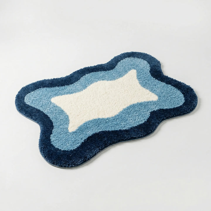 Unisex luxury non-slip bath rug by Flowique. Modern wave pattern offers comfort, absorbency, & safety.
