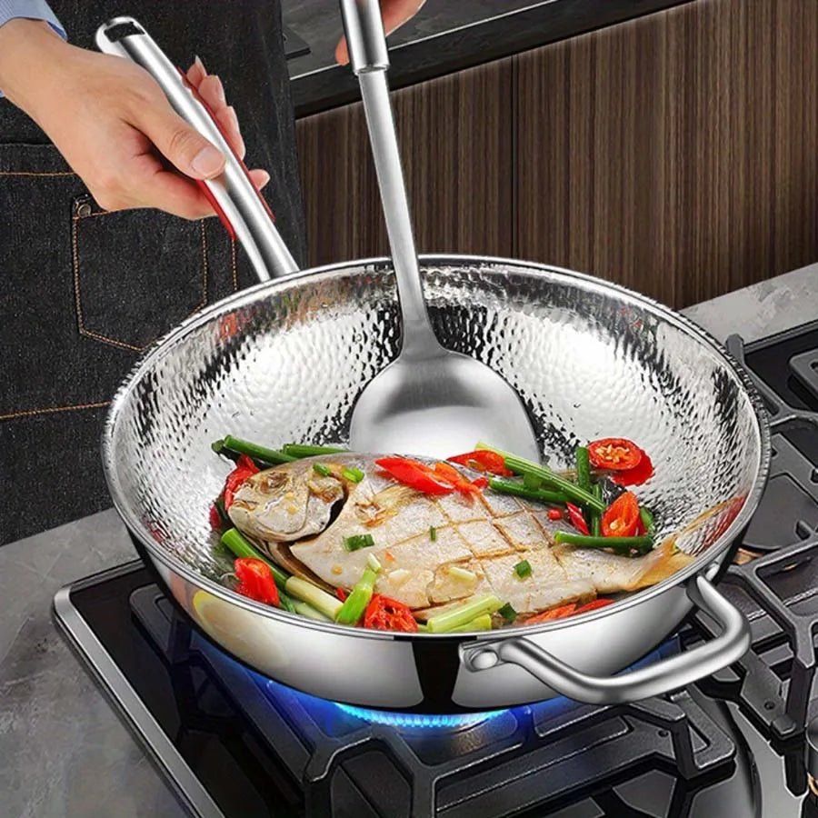 Versatile titanium induction wok, perfect for stir-frying. Nonstick round-bottom design ensures even heating & easy meals.