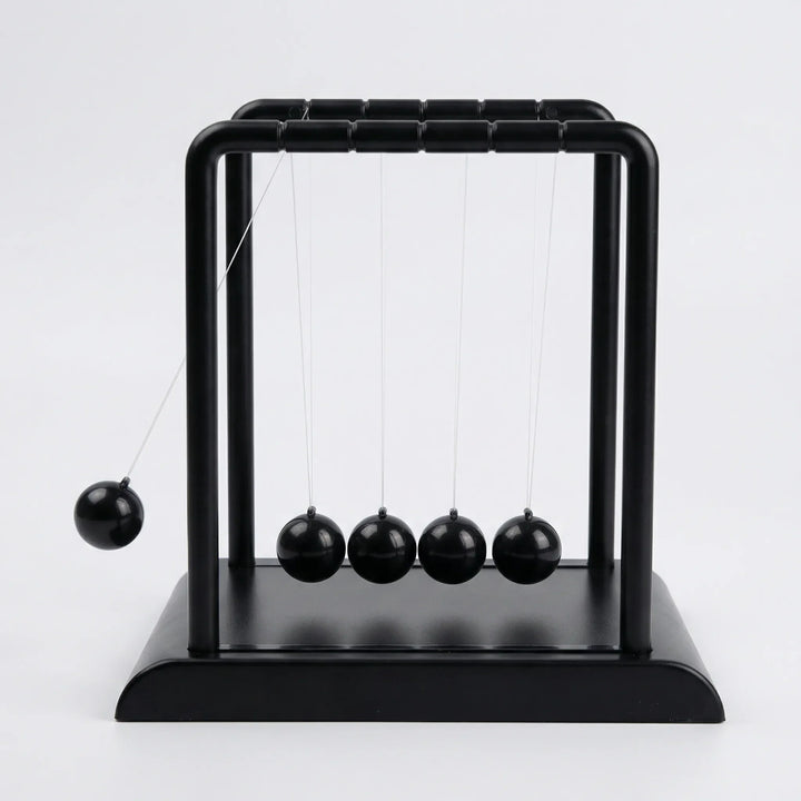 Calming kinetic desk ornament with magnetic motion, perfect tabletop sculpture for relaxation.