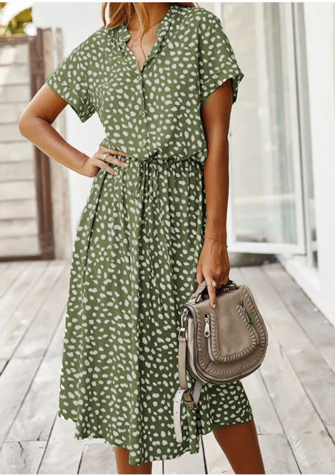 Full shot: Model in stylish spotted button-down midi dress, perfect for spring casual wear.