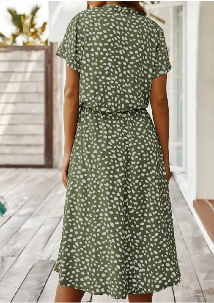 Women's casual button-down midi dress in vibrant spotted print, perfect for everyday spring style.