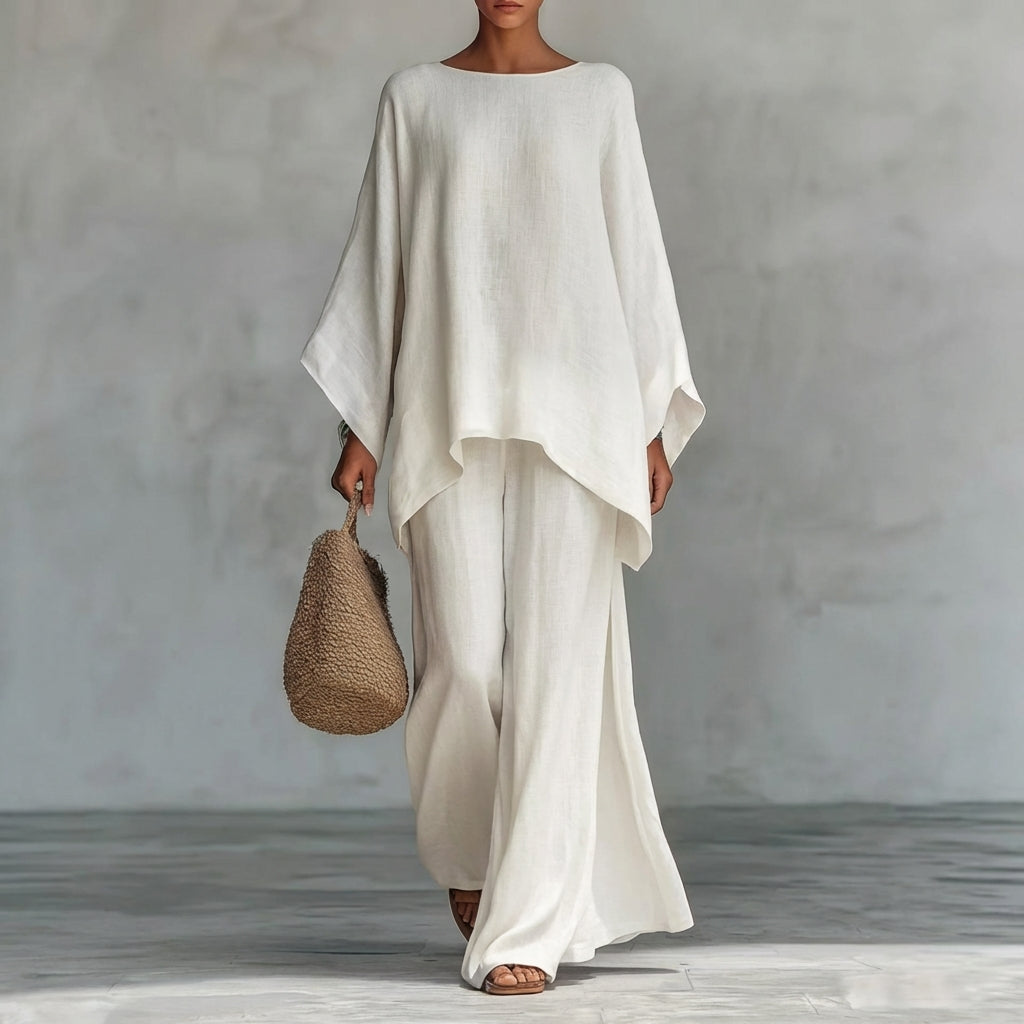 Chic women's two-piece set: flowy tunic top & maxi skirt. Versatile for travel, brunch, or resort wear.