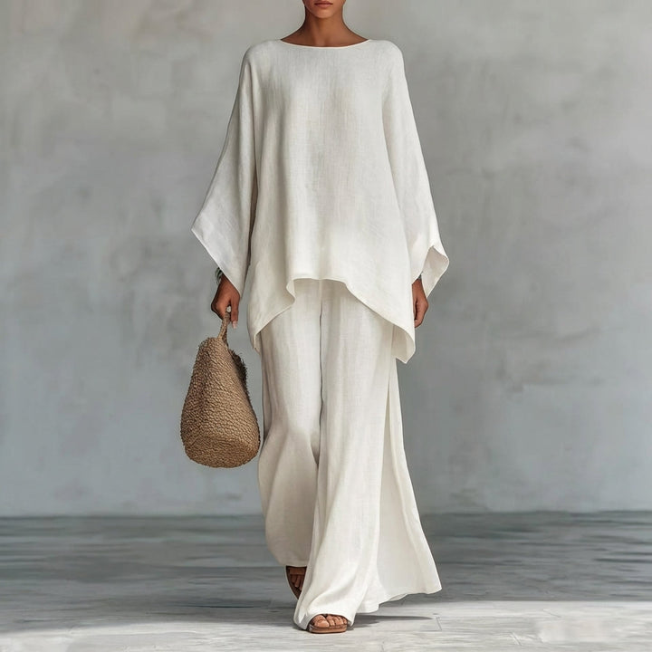 Chic women's two-piece set: flowy tunic top & maxi skirt. Versatile for travel, brunch, or resort wear.
