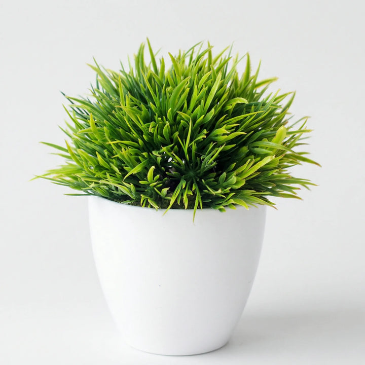 Compact sculpted tabletop tree, faux plant adds peaceful, elegant touch to small spaces.