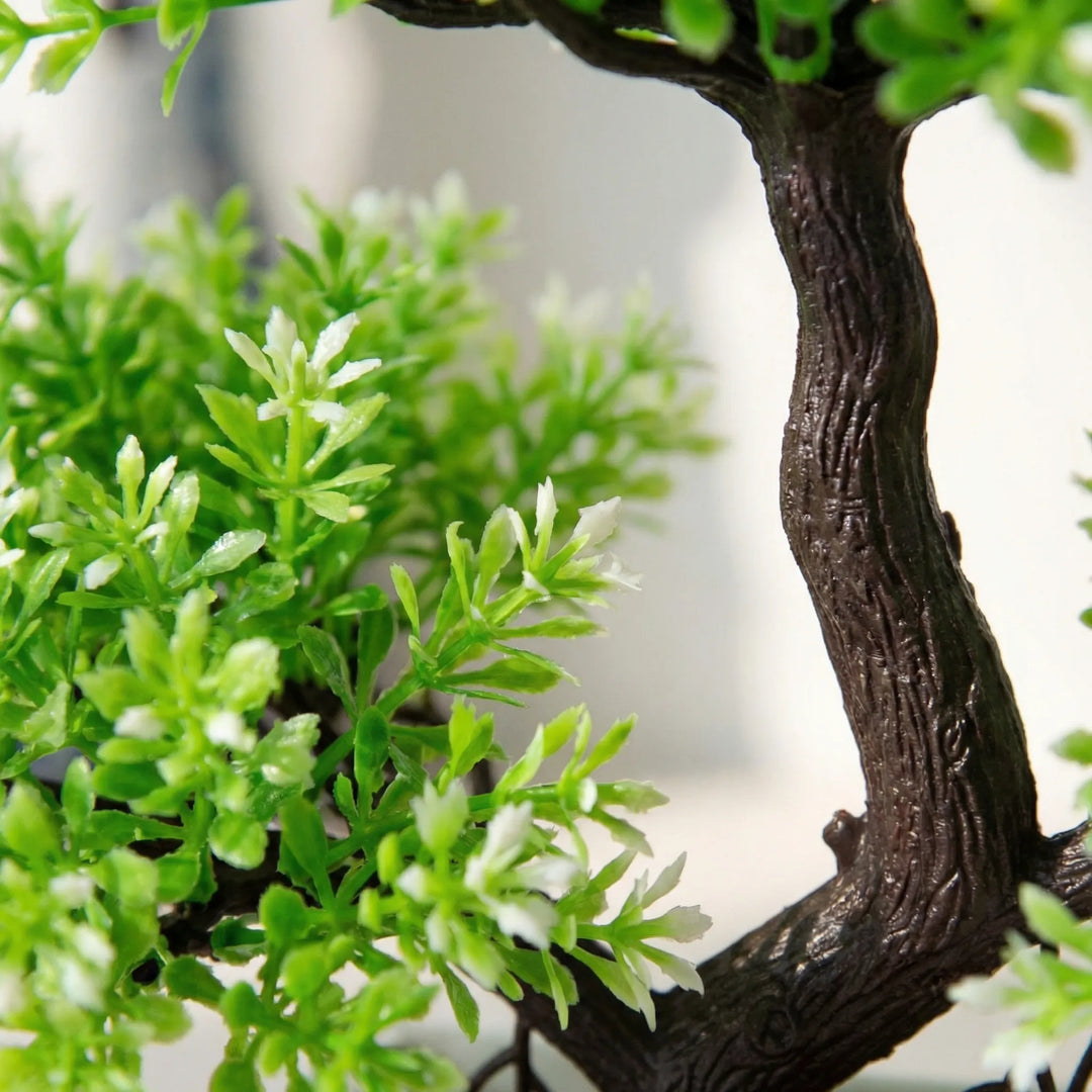 Green & white sculpted mini tree, ideal artificial plant for serene living room decor.