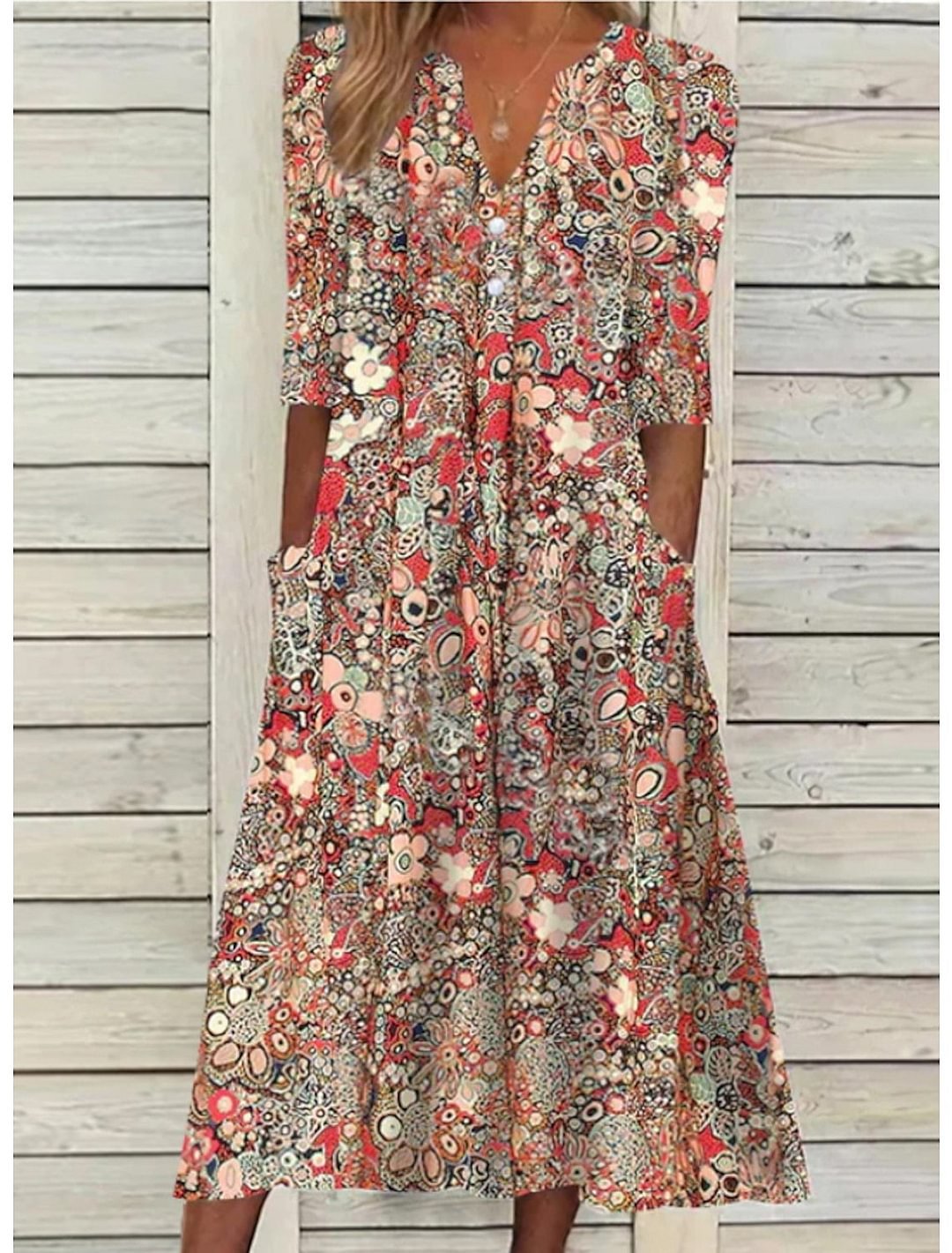 Women's bohemian floral print midi dress with relaxed fit, V-neck, and half sleeves, perfect for summer casual wear.