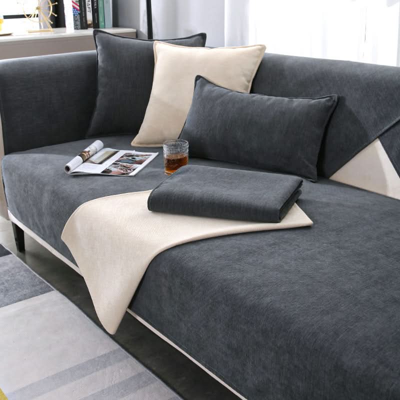 Modern universal sofa cover in a neutral tone, protecting furniture from pets & spills. Stylish living room decor.