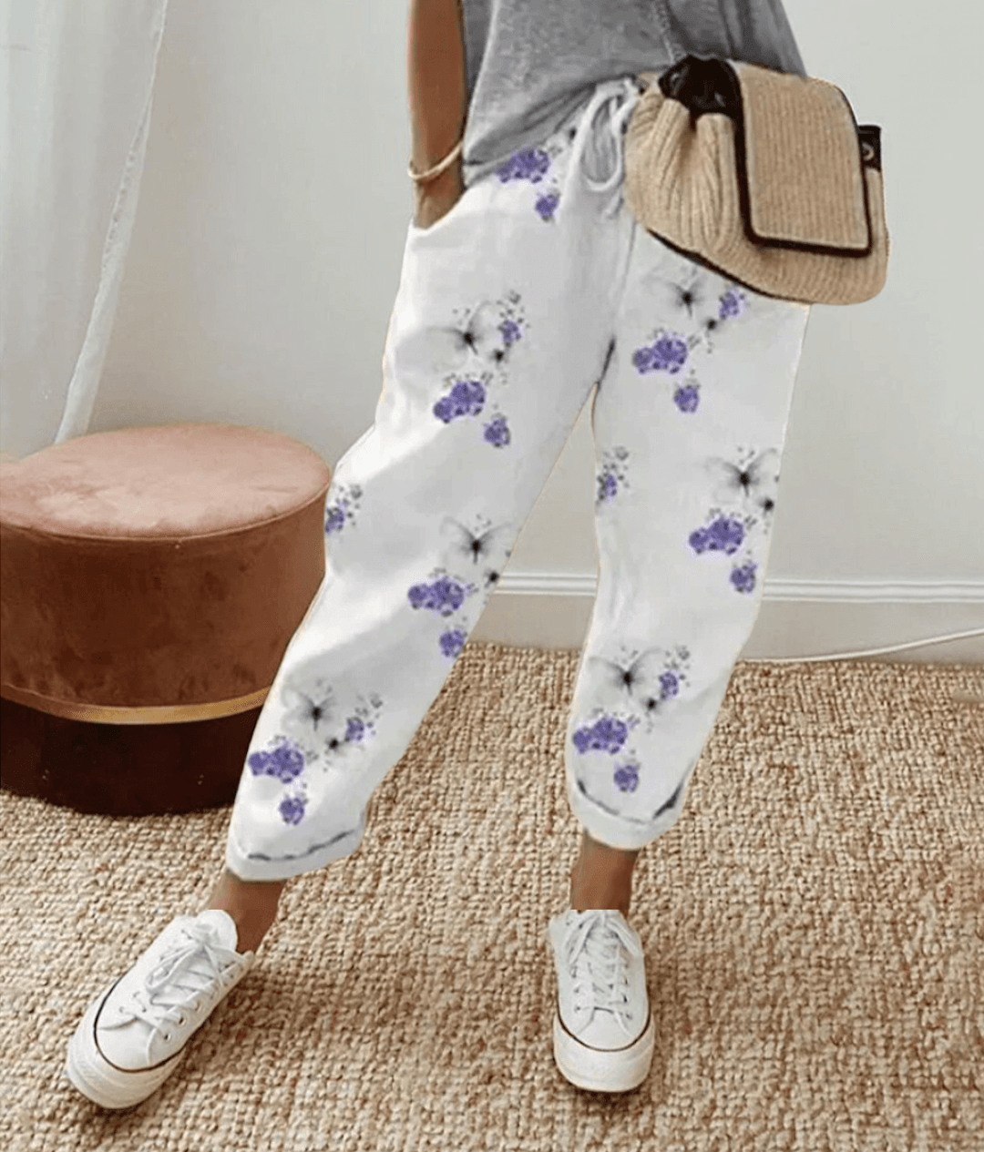 Stylish women's print trousers with a drawstring waist for a flattering, comfortable look. Perfect for casual outfits.