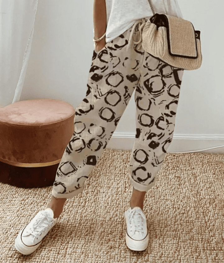 Versatile women's relaxed fit print trousers, ideal for effortless style. Available in striped & floral patterns.