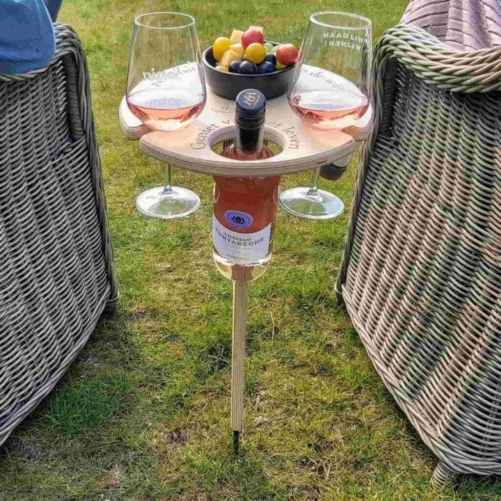 Portable wooden wine table for outdoor picnics. Holds wine bottle & two glasses, perfect for beach, garden, or camping.