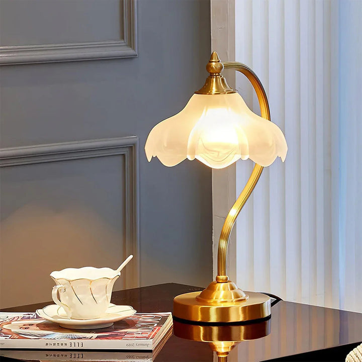 Bedside floral glass lamp with a golden finish, offering dimmable, soft decorative light.