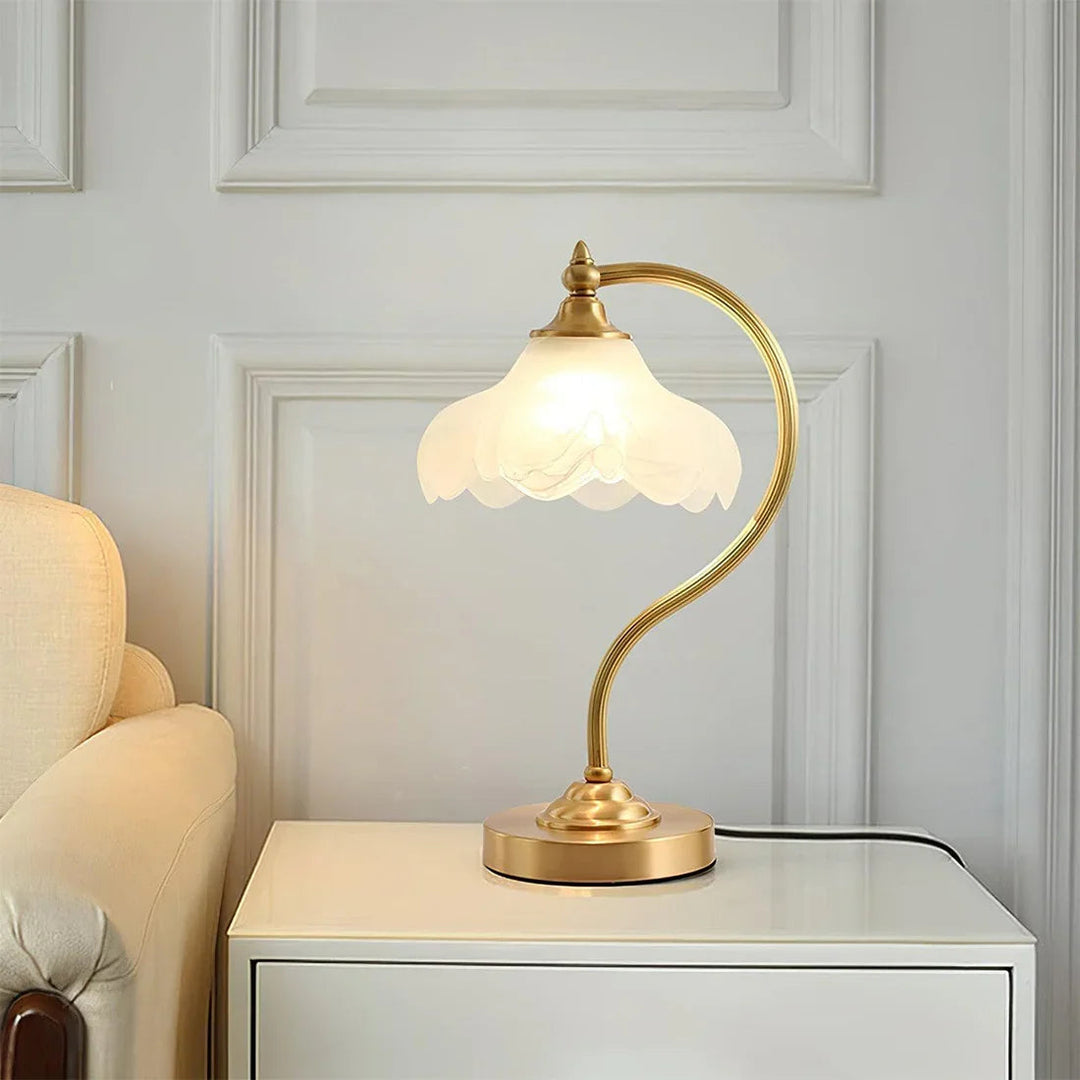 Accent lighting: Elegant floral glass table lamp with dimmable feature & gold-tone base.