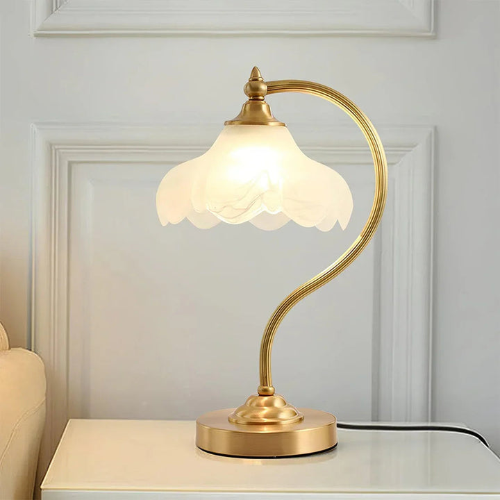 Dimmable floral glass table lamp with elegant gold brass base, ideal for modern interiors.