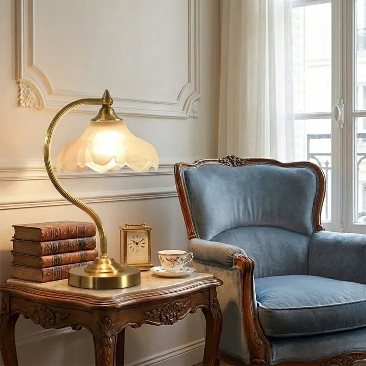 Decorative glass table lamp with elegant floral motifs & adjustable brightness for any room.