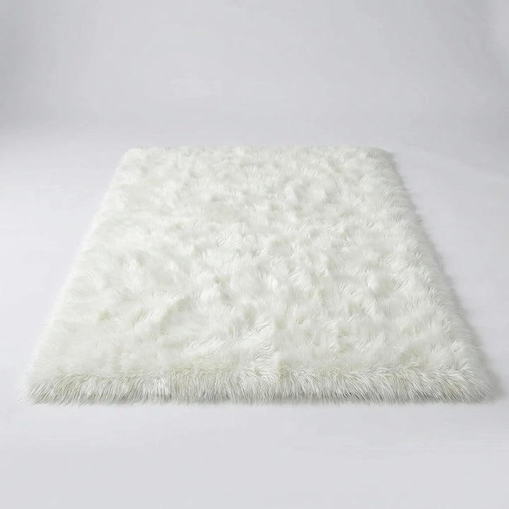 Flowique statement area rug with elegant wave design, a soft plush floor covering for modern living rooms.