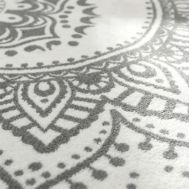 Decorative round bohemian rug featuring a unique Flowique wave design. Ideal accent area rug for stylish home interiors.
