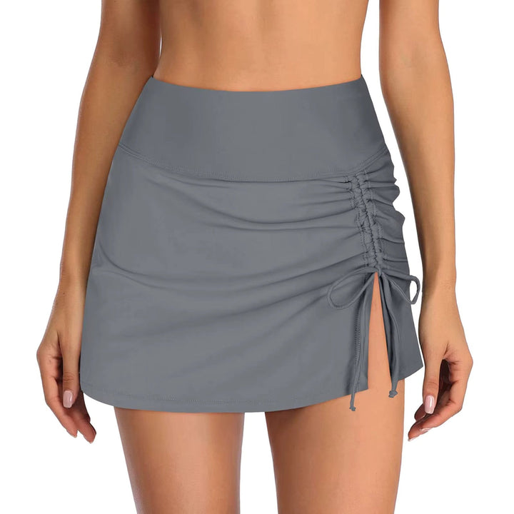 This women's ruched high-waist swim skirt offers stylish coverage. Perfect for beach and poolside.