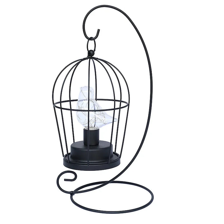 Charming birdcage table lamp with warm LED glow for cozy ambiance. Decorative, vintage, and perfect for any room.