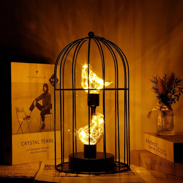 Vintage birdcage LED table lamp with warm fairy lights, perfect cordless home accent.