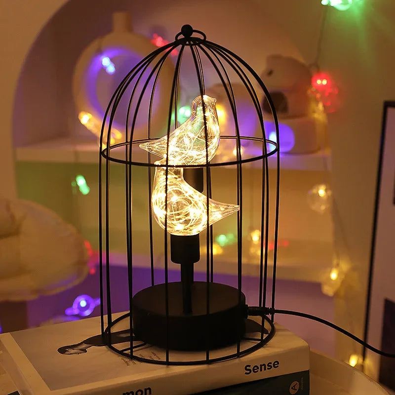 Vintage-style birdcage table lamp featuring a warm LED glow, ideal for decorative accent lighting & home decor.