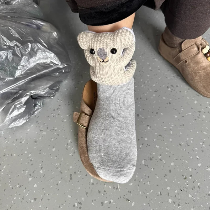 Comfortable fluffy house socks with a charming 3D animal design and secure non-slip bottom for home.