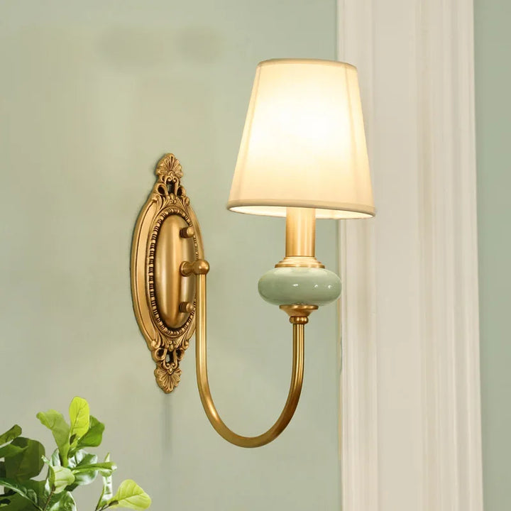 Elegant antique copper ceramic wall sconce, perfect bedside or living room ambient lighting.