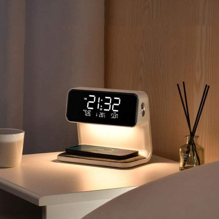 Black 3-in-1 wireless charging lamp, LED alarm clock, & smart hub with touch control, perfect for any bedside.