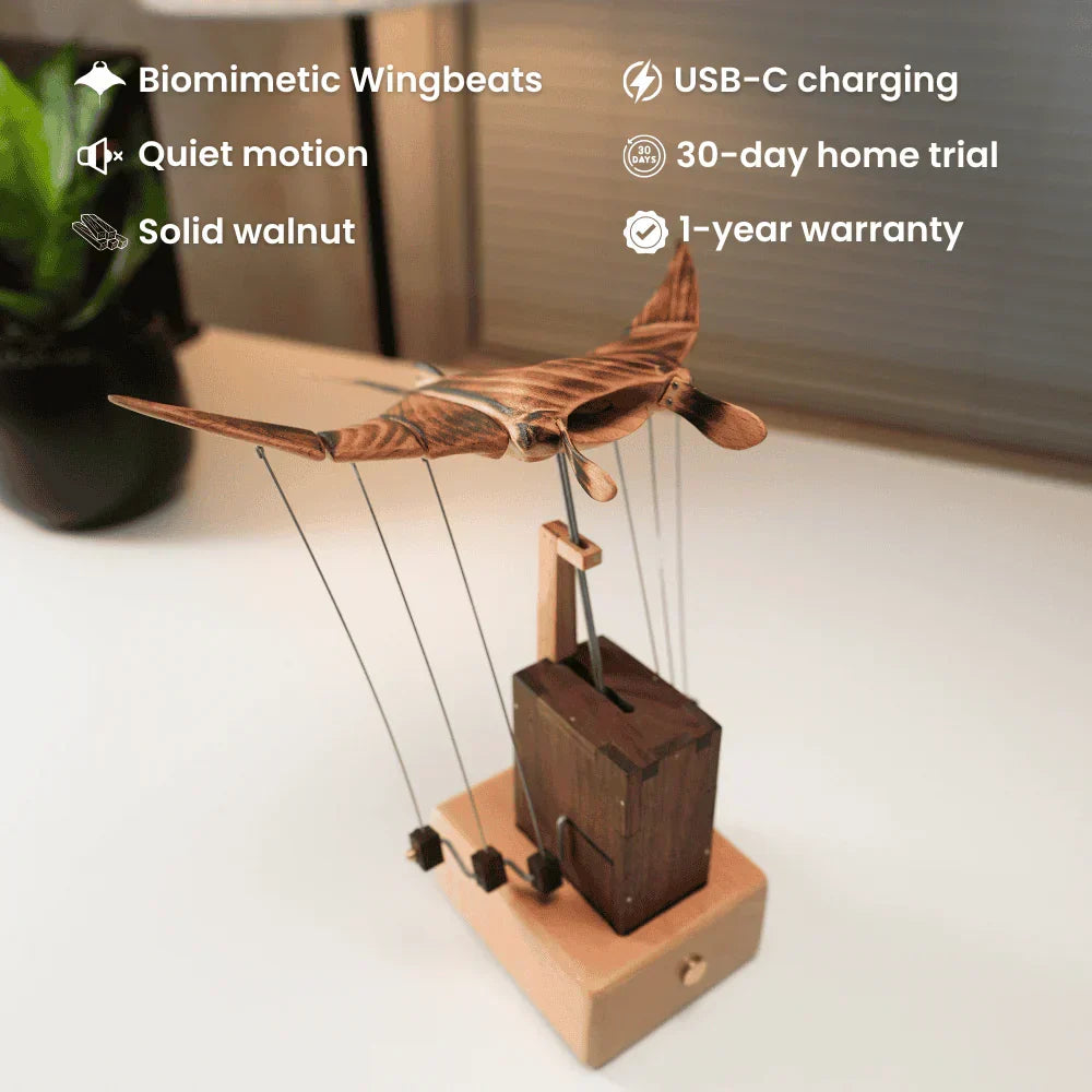 Captivating kinetic manta ray desk sculpture, hand-cranked wooden art, perfect desktop ornament for a home office.