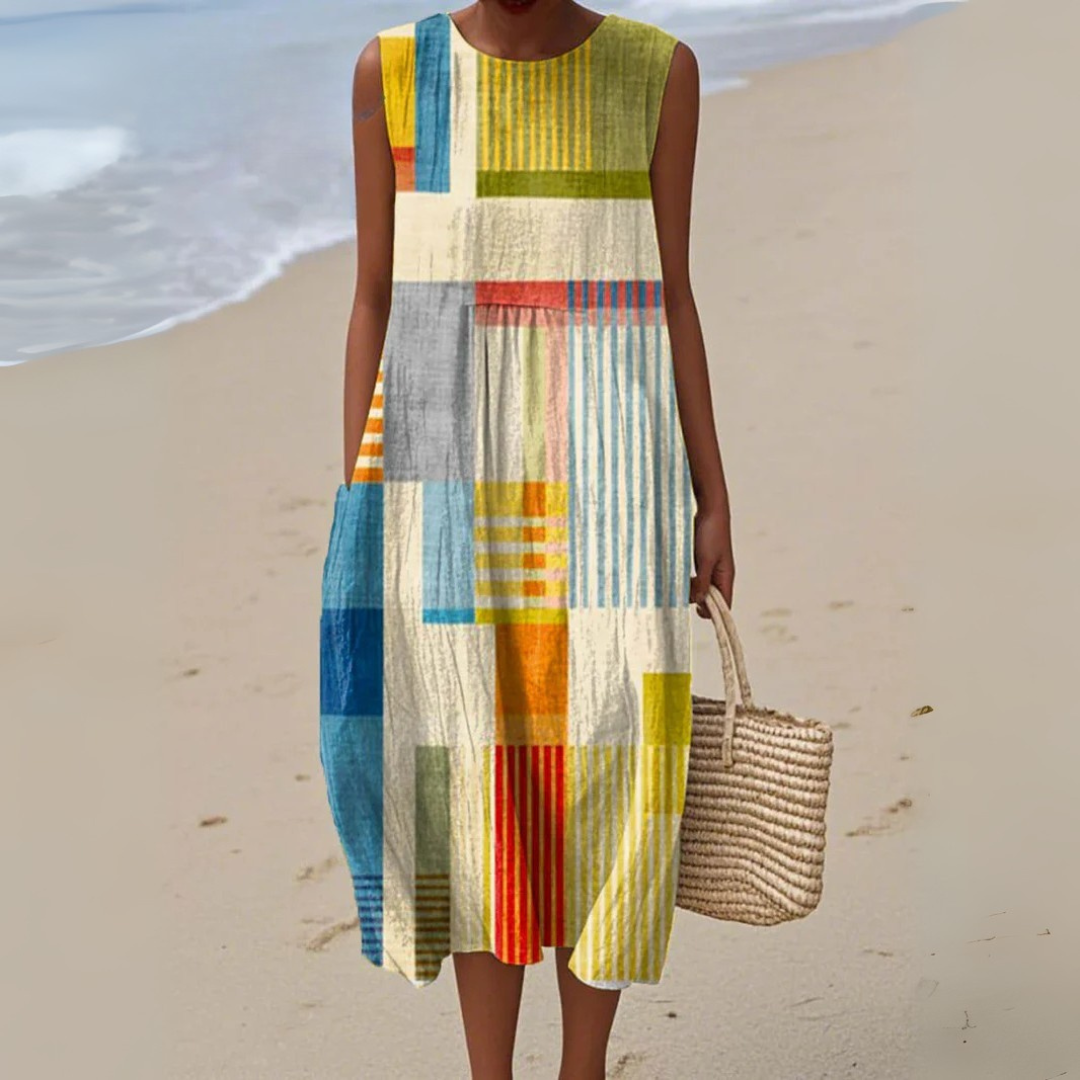Women's sleeveless geometric patchwork midi dress with a relaxed, flowy fit, perfect for casual summer or vacation.