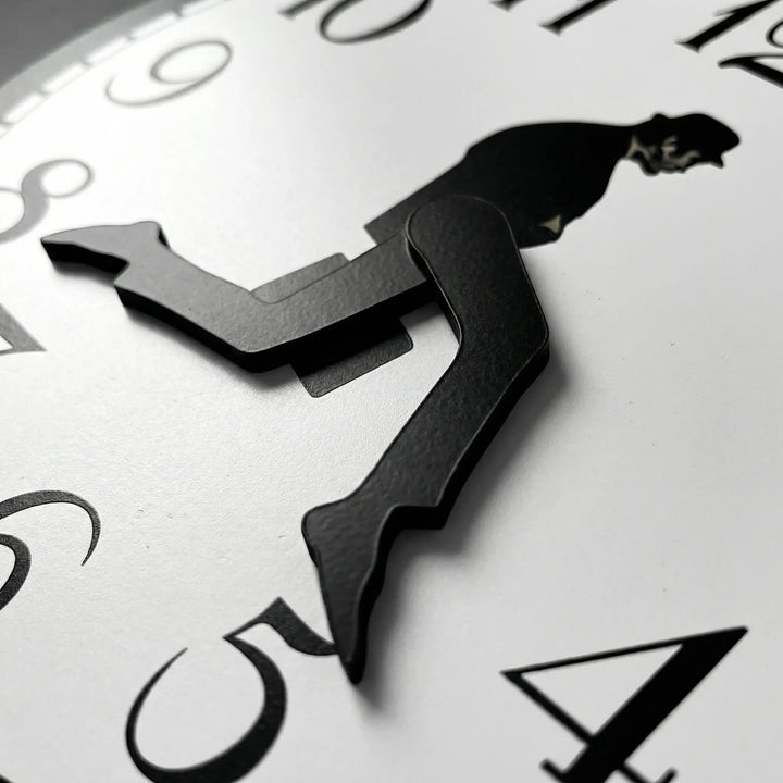 Playful whimsical wall clock; a modern home accent. Easy-read timepiece for stylish living room or office decor.