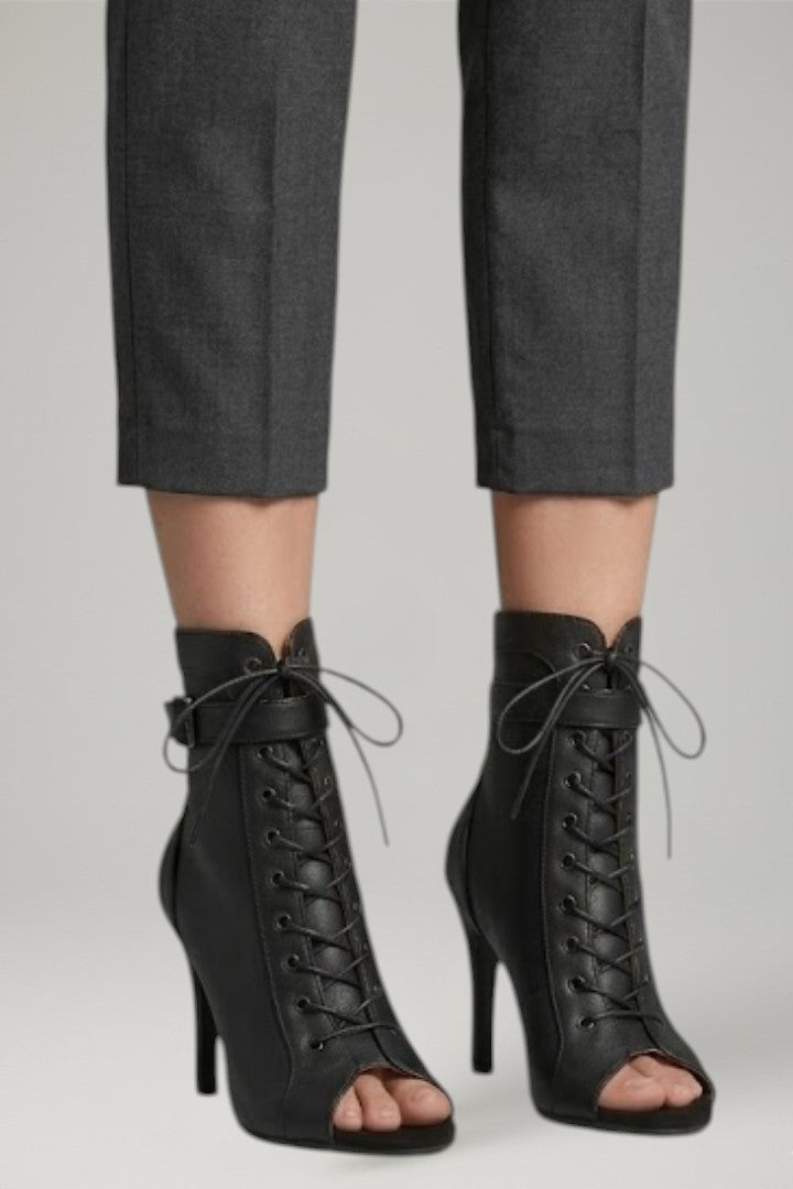 Stylish women's open-toe heels with delicate strappy design & stiletto heel, ideal for dressy evenings.