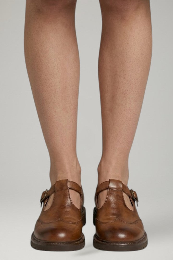 Cushioned women's Mary Jane sandals with an adjustable strap, offering all-day comfort & classic style.