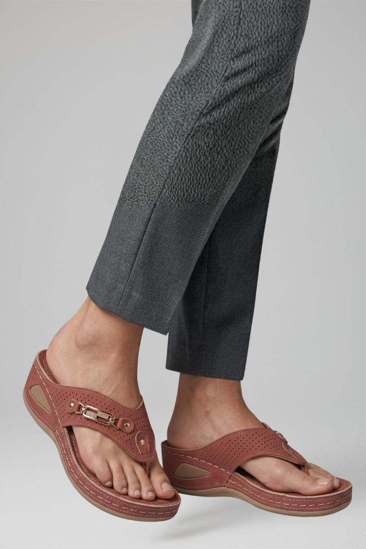 Open-toe women's sandals with adjustable straps and a plush cushioned sole for ultimate comfort.