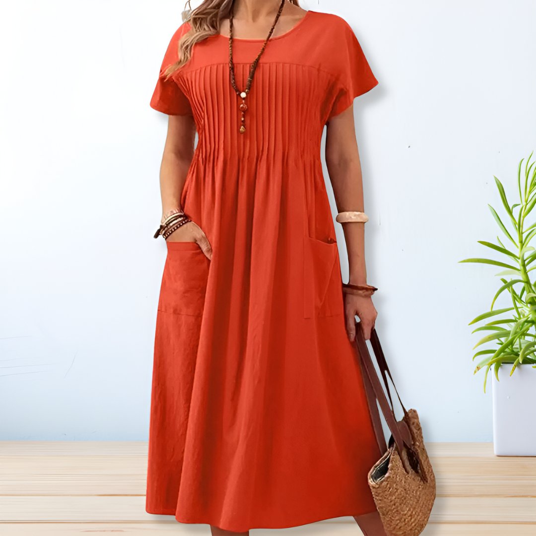 Women's relaxed fit midi day dress with short sleeves, perfect for casual everyday wear. Comfortable and stylish summer outfit.