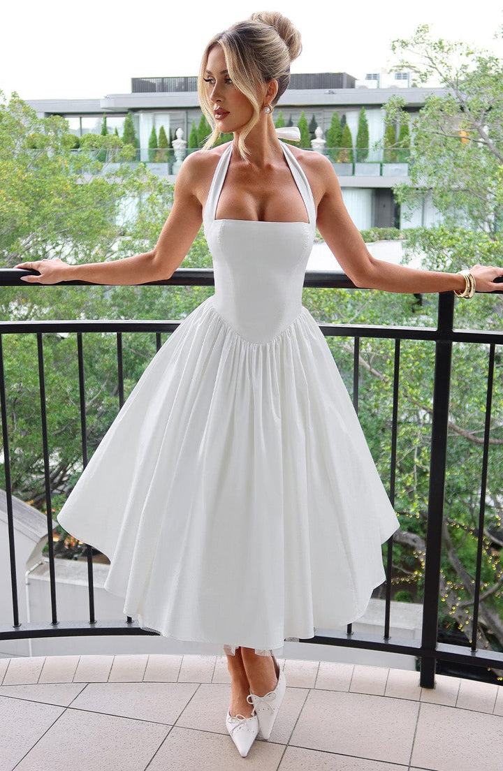 Ariana halter midi dress in black and white, women's wedding guest dress with fitted waist and flowy skirt