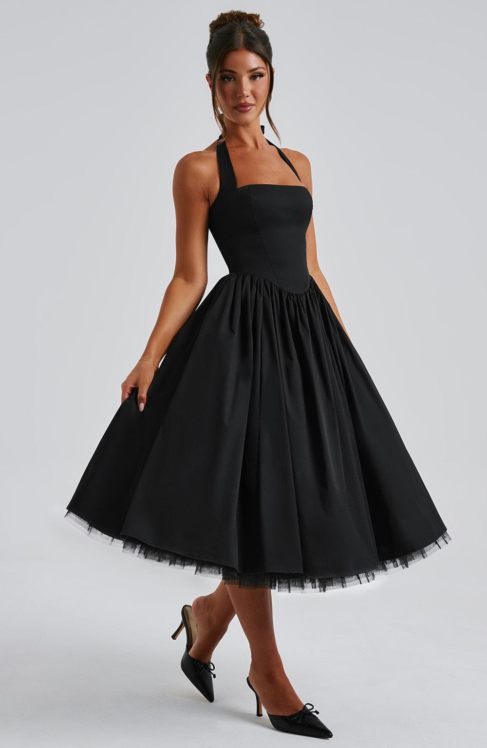 Close-up of halter neckline on black and white midi dress, women's occasion wear suitable for UK weddings