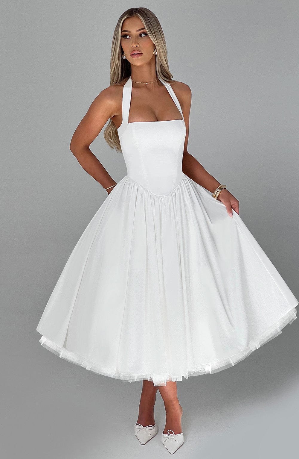 Back view of Ariana halter midi dress by Ash New York, black and white women's wedding guest outfit