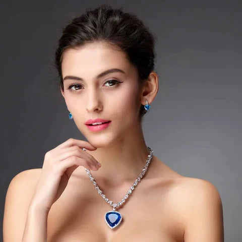 Radiant sterling silver heart pendant necklace, exquisitely set with shimmering blue zirconia.