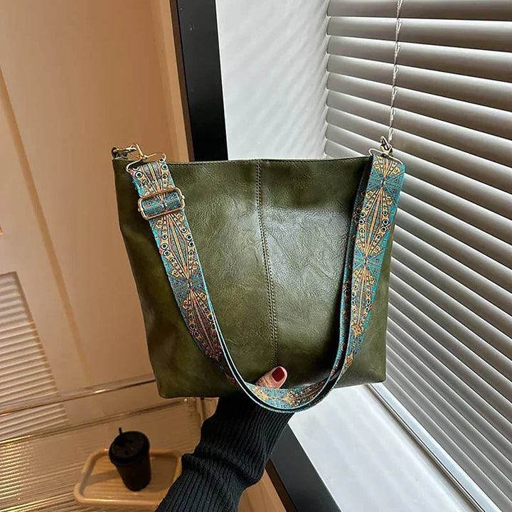 Stylish women's boho hobo shoulder bag with a patterned strap, ideal for bohemian outfits and everyday carry.